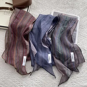 Japanese style striped linen skinny scarf with retro aesthetic on a white lace background