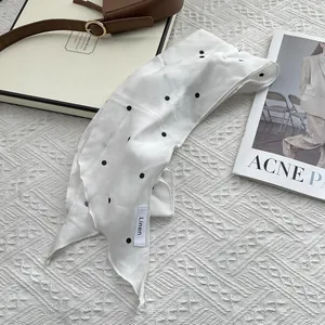 Breathable linen skinny scarf featuring classic black polka dots on white background