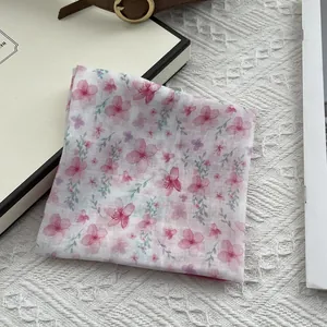 French camellia silk scarf with pink floral pattern on elegant white background