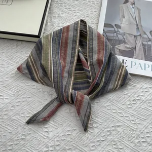 Japanese style colorful striped cotton scarf on a textured white background