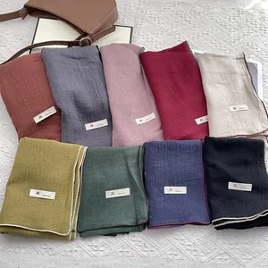 Japanese style linen narrow scarves in nine solid colors with contrast stitched edges