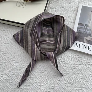 Detailed texture of cotton striped neckerchief with purple and grey woven patterns
