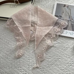 Close-up of light pink linen scarf featuring exquisite 3D floral lace edge detailing