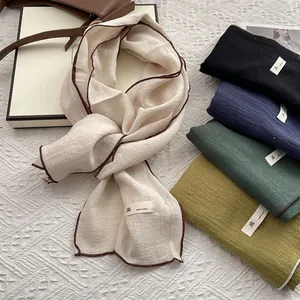 Minimalist linen scarf for women with contrast trim and natural texture in multiple colors