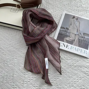 Detailed macro view of retro striped linen scarf texture and finely hemmed edge finish