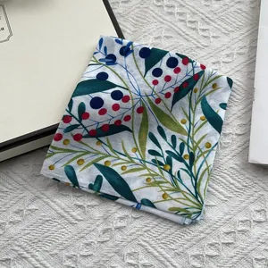 Detailed close-up of floral cotton linen neckerchief with botanical plant pattern