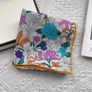 Floral cotton linen neck scarf with yellow rolled edges and fresh botanical prints