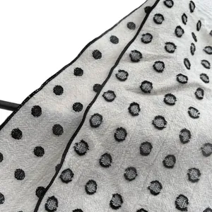 Retro linen-cotton scarf with black polka dots and delicate stitched edge detail