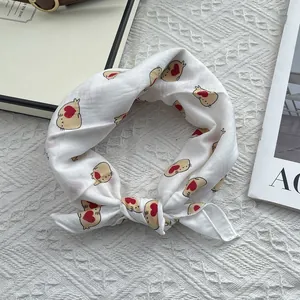 Detail view of white cotton neck scarf with cute animal and red heart prints