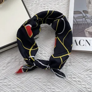Detail of floral cotton linen square scarf with yellow geometric lines on black fabric
