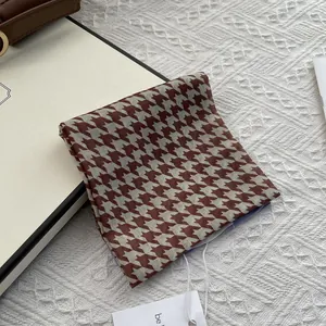 Brown and beige houndstooth cotton linen square scarf displayed in an elegant gift box