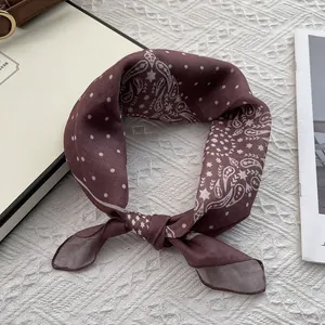 Macro detail of burgundy paisley cotton linen scarf with white polka dots and stars