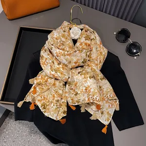 Floral cotton linen scarf in orange and yellow with elegant fringe for summer sunscreen