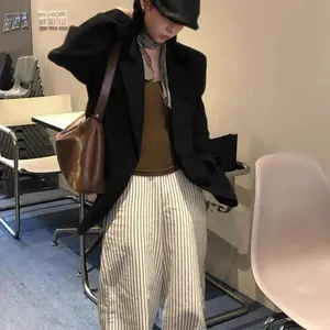 Retro style pure linen plaid scarf paired with a black blazer and striped trousers