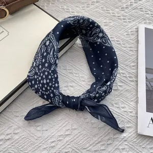 Detail of navy blue paisley cotton linen square scarf with polka dot patterns