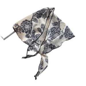 White floral cotton triangle head scarf with navy blue flowers and black stitched edges