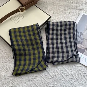 Close-up of lightweight checkered pure linen scarves with premium overlock stitch edges