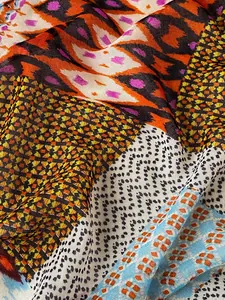 Detail of lightweight bohemian scarf showing colorful geometric patterns and fabric texture