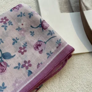 Detailed view of lavender floral cotton linen scarf with edge stitching and mesh texture
