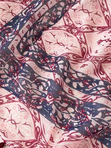 Close-up of bohemian geometric print scarf showing soft texture and fringe detail