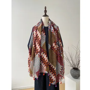 Bohemian geometric printed lightweight scarf with tassels on a fashion mannequin