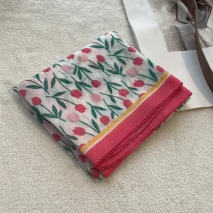 Detail of tulip floral print cotton linen square scarf with pink contrast border