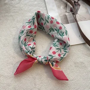 Detail view of cotton linen scarf with red tulip floral print and stitched borders