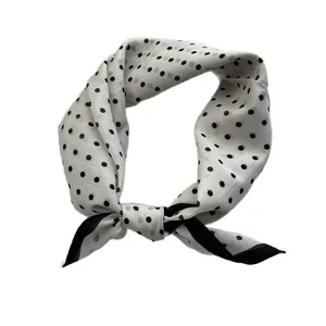 Classic white silk neck scarf with black polka dots and black border in a knotted style