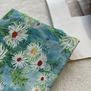 Detailed view of light blue daisy floral pattern on soft cotton neckerchief scarf