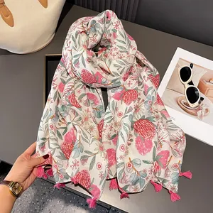 Lightweight cotton linen floral scarf with pink flower prints and tassel details