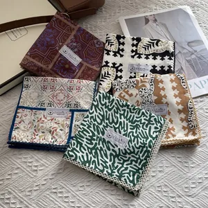 Detailed close-up of colorful cotton neckerchiefs with vintage patterns and wavy lace edges