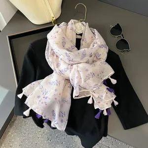 Floral print summer scarf with tassels in elegant beige, purple, and red hues