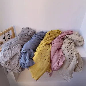 Linen blend polka dot scarf set in grey and pastel tones with frayed fringe edges