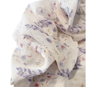 Floral print cotton linen shawl with purple and red flowers on a creamy white base