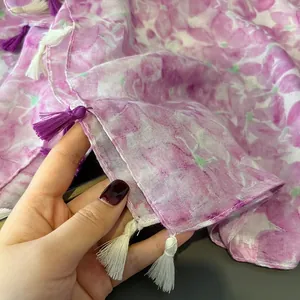 Lightweight sheer floral scarf in purple and white with elegant fringe tassels