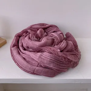Detail of purple cotton linen scarf showing soft pleated texture and delicate lace edge