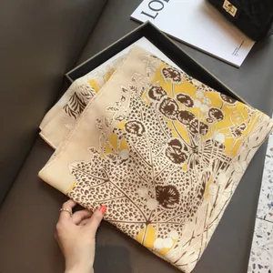 Floral and tiger print silk scarf presented in a premium black gift box with accessories