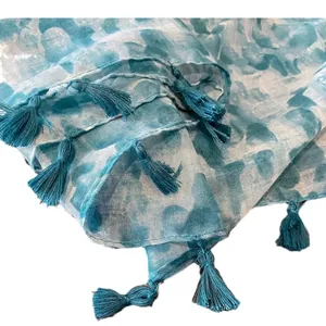 Lake blue bohemian scarf with abstract tie-dye patterns and elegant tassel edges