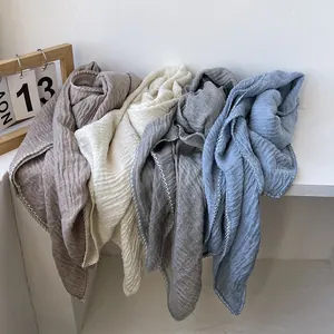 Wrinkled cotton linen scarves in brown, beige, grey and blue with wavy stitched edges