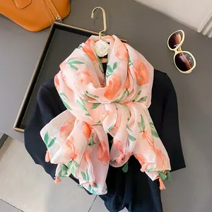 Peach print linen feel scarf for women with pink and green tassels for sun protection