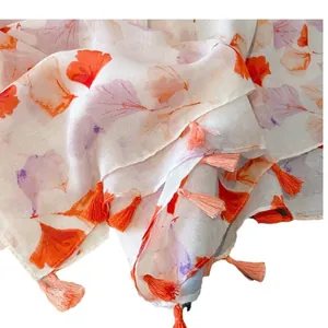 Women's lightweight ginkgo leaf print scarf with orange fringes for summer travel