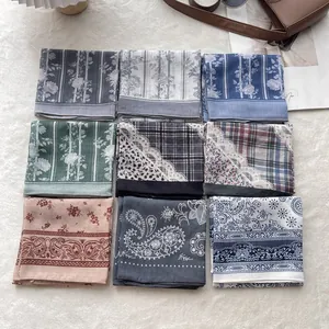 Set of 9 cotton linen neck scarves with floral and plaid patterns on plush background