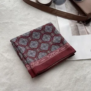 French vintage wine red geometric cotton linen headscarf on a stylish display