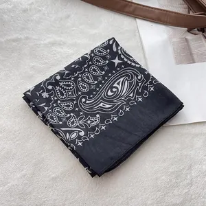 Detail of black paisley cotton bandana showing high-quality print and neat hemmed edges