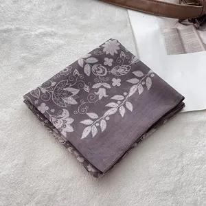 Detailed view of purple floral cotton bandana scarf showing white paisley patterns