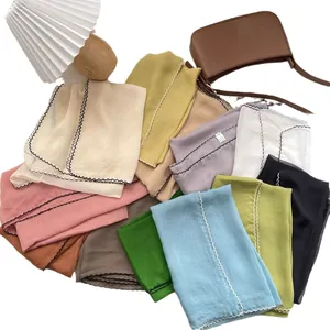 Lightweight sheer chiffon scarves in various colors with elegant wavy scalloped edges