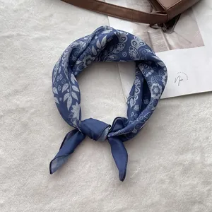 Detailed view of knotted blue and white floral pattern cotton linen headscarf for women