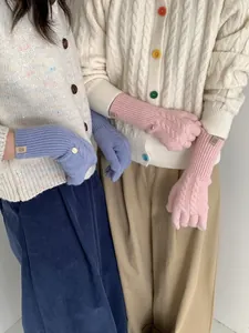 Detailed cable knit pattern on warm wool blend gloves with ribbed elastic cuffs