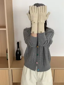 Detailed knit cable pattern and leather patch on cream wool blend touchscreen gloves