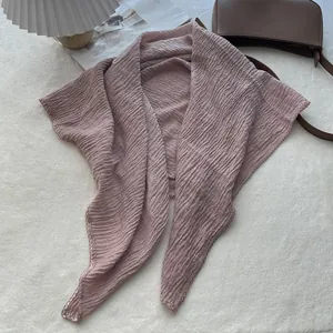 Detailed close-up of pink pleated cotton linen scarf with delicate lace edge finish
